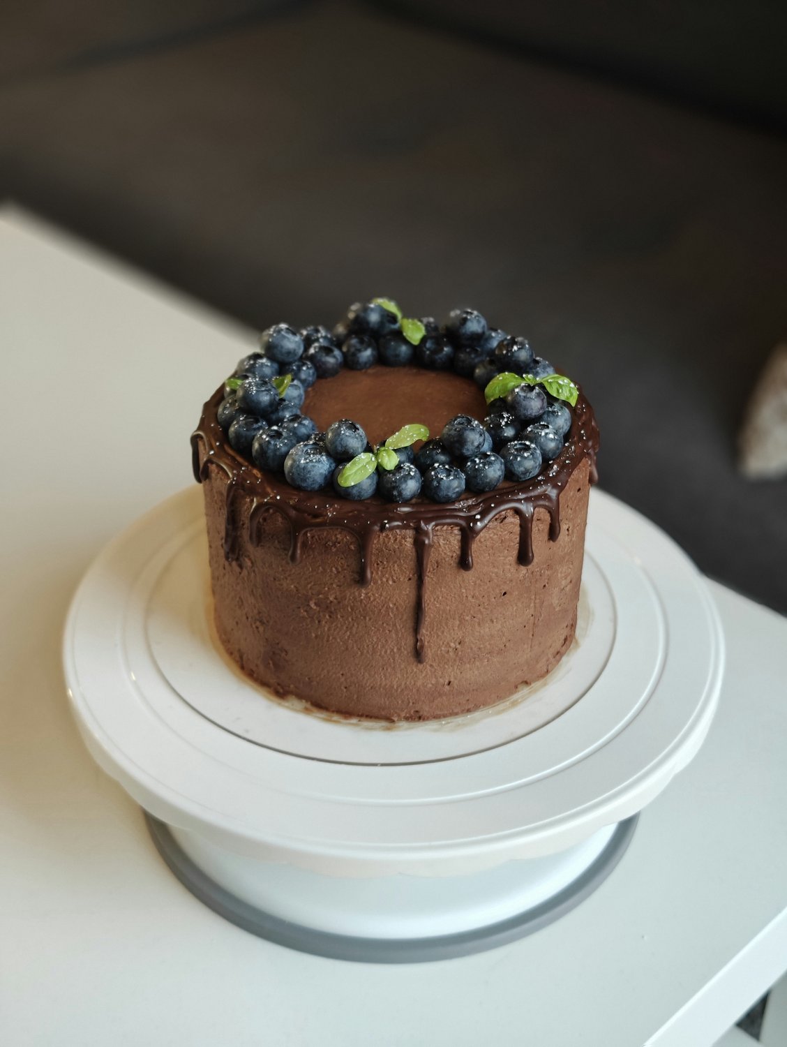 Dark chocolate blueberry cake with glossy drip